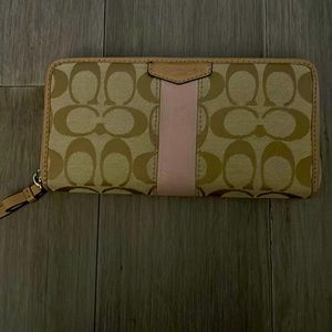 Beige Coach wallet with pretty pink accent